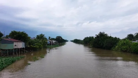 Low Altitude Drone Flying Over Straight Canal lined with Greenery Stock-Footage 343606693