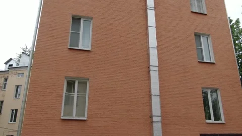 Low altitude drone orbit around apartment building Video stock 327846805