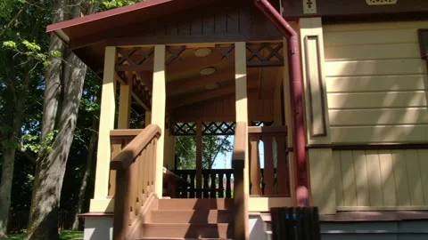 Low altitude drone orbit around wooden park house Stock Footage 333414832