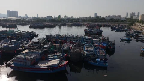 Low altitude drone pass above traditional fishing fleet in Da Nang Stock Footage 340199135