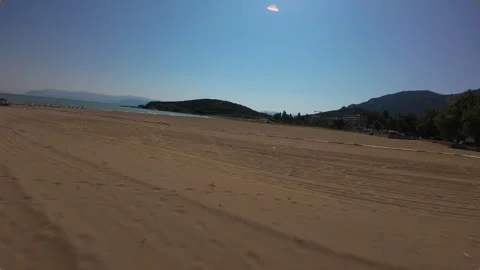 Low-altitude drone shot flying fast over the sandy beach of Egirdir Lake Stock Footage 344038668