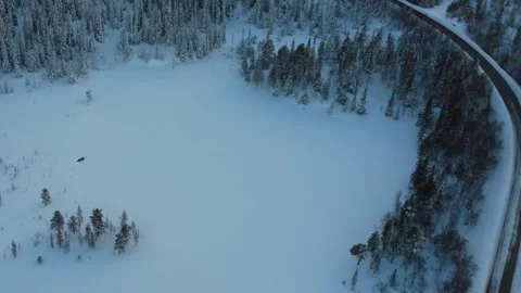 Low Altitude Drone Speed Flight Above Snow Covered Road Norway 4K Video stock 330670825