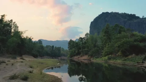 Low altitude drone view of Nam Hinboun river in Kong Lor, Laos Stock Footage 247383984