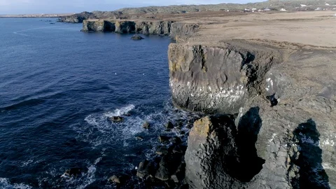 Low Altitude Flight along Cliffs at Arnarstapi Iceland in 4K Stock Footage 89154461