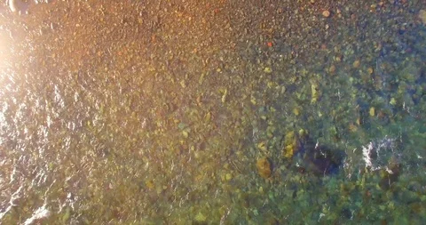 Low altitude flight over fresh fast mountain river with rocks at sunny summer Stock Footage 115088922