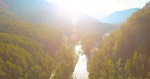 Low altitude flight over fresh fast mountain river with rocks at sunny summer Stock Footage 115089586