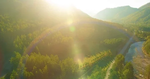 Low altitude flight over fresh fast mountain river with rocks at sunny summer Video stock 125905931