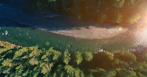 Low altitude flight over fresh fast mountain river with rocks at sunny summer Stock Footage 127346715