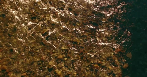 Low altitude flight over fresh fast mountain river with rocks at sunny summer Stock Footage 127487271