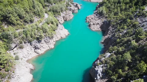 Low altitude flight over fresh fast mountain river with rocks at sunny summer Stock Footage 130397495