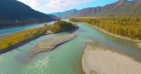 Low altitude flight over fresh fast mountain river with rocks at sunny summer Stock Footage 285478934