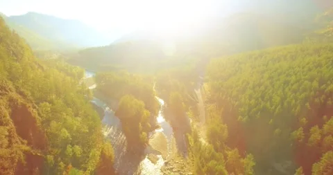 Low altitude flight over fresh fast mountain river with rocks at sunny summer Stock Footage 291783767