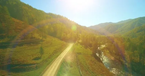 Low altitude flight over fresh fast mountain river with rocks at sunny summer Stock Footage 294488843