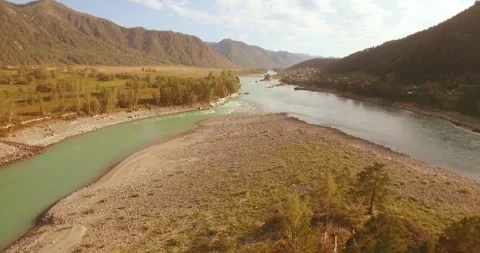 Low altitude flight over fresh fast mountain river with rocks at sunny summer Stock Footage 294489529