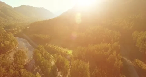 Low altitude flight over fresh fast mountain river with rocks at sunny summer Stock Footage 310718548