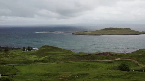 Low altitude flight over a meadow to reveal Eilean Flodigarry island 스톡 동영상 116109023