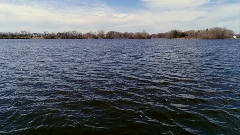 Low altitude flight over water. Stock Footage 106829155