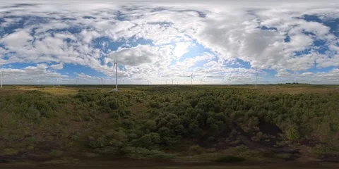 Low altitude flight through windfarm Stock Footage 345524341