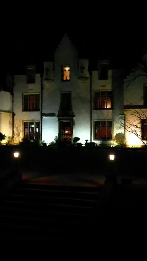 Low Altitude flying through lampposts haunted house luxury hotel property night Stock Footage 280756286