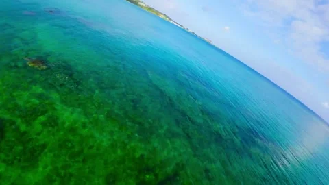 Low Altitude FPV Drone Sea Shaving Dash Along Okinawa Coast 4K Stock-Footage 335511296