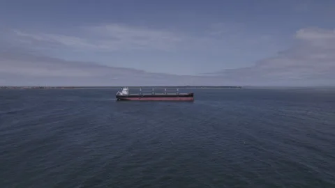 Low Altitude Wide-angle Drone Footage Cargo Vessel Pacific Ocean Cloudy Day. Video stock 262636848