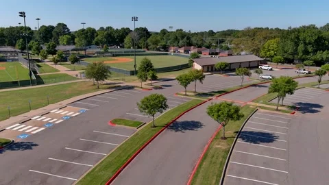 Low and slow drone point-of-view flight over parking lot Stock Footage 208894944