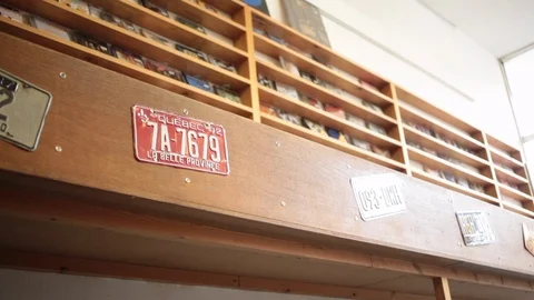Low angel still shot looking up at display shelving in vinyl record store Stock-Footage 98742575