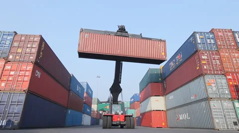 Low angle of 3 Containers cranes carrying containers in container yard 1 Stock Footage