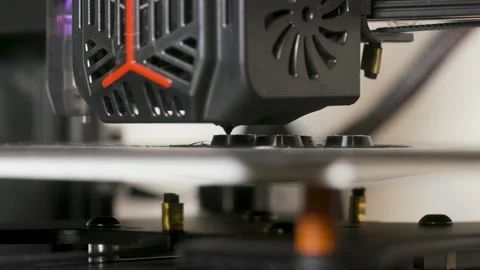 Low angle of a 3D printer making a part from PLA filament Stock Footage 264054435