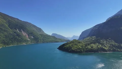 Low Angle Aerial Glid Over the Deep Blue Surface of Lago di Molveno Ital Stock Footage 337923781