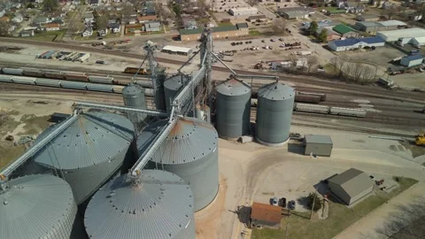 Low Angle Aerial Orbit Around Towering Grain Silos And Conveyors Stock Footage 342155702