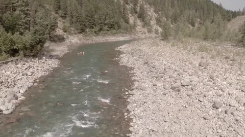 Low Angle Aerial Pullback along River Stock Footage 71603787