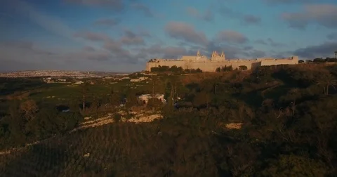 Low angle aerial shot looking towards Mdina Stock Footage 74413437