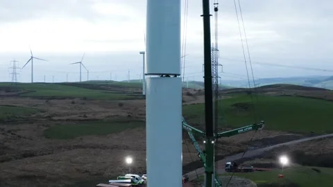 Low angle Aerial Shot of a wind turbine construction, 4K Stock Footage 179330432