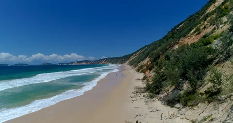 Low angle aerial view of beach and surf at Rainbow beach,Queensland,Australia Stock Footage 140549278