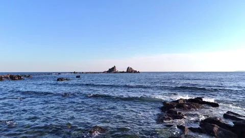 Low Angle Aerial View of Rocky Shore and Tide Pools Manazuru 4K Stock Footage 329058197