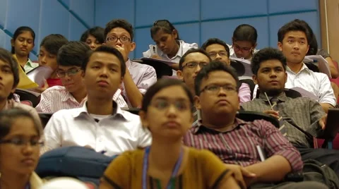 Low Angle and Pan Shot of Asian Students Sitting Inside A Lecture Hall Stock Footage 49388683