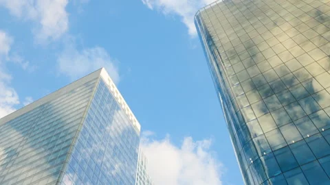Low-angle architectural view looking up at modern corporate skyscrapers with ref Stock Footage 338027446