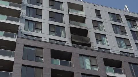 Low-angle architectural view of a modern apartment building 库存影片 335454617