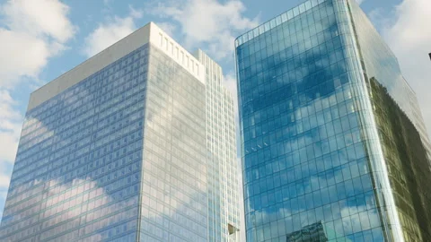 Low-angle architectural view of modern corporate glass skyscrapers in a financia Stock Footage 338027279