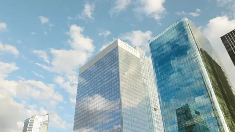 Low-angle architectural view of modern corporate glass skyscrapers in a financia Stock Footage 338027310