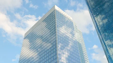 Low-angle architectural view of modern corporate skyscrapers with glass facades, Stock Footage 338027387