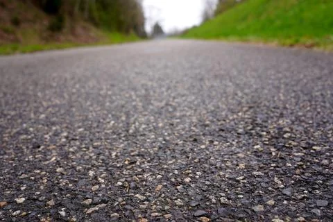 Low angle asphalt road texture with bokeh background, highway path for trav.. Stock Photos
