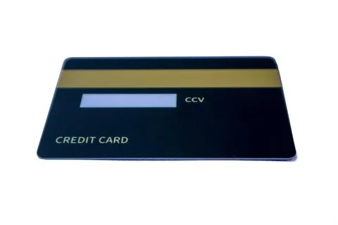 Low-angle back view of a dark blue credit card with magnetic stripe and CCV.. Stock Photos