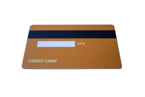 Low-angle back view of an orange credit card with magnetic stripe and CCV p.. 写真素材