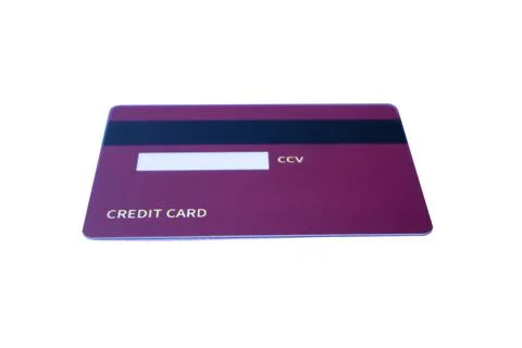 Low-angle back view of a purple credit card with magnetic stripe and CCV pa.. Stock Photos