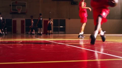 Low angle of basketball players warming up before a game Stock Footage 70685917