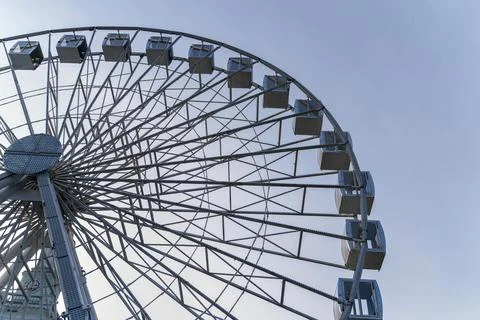 Low angle of big ferry wheel in the city Stock Photos