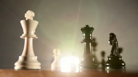 Low angle of black queen checkmating white king in chess game. Stock Footage 55616856
