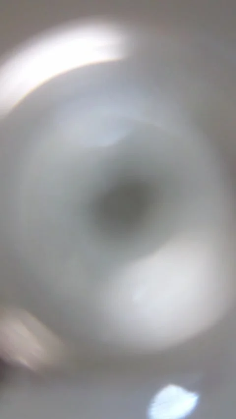 Low-angle blurred view of wine pouring into a glass. Stock Footage 325490217